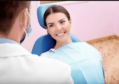 dentist talking to woman
