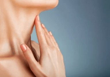 woman touching neck