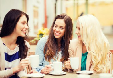 three friends drinking coffee