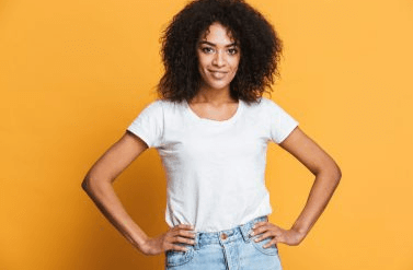 woman smiling with orange background