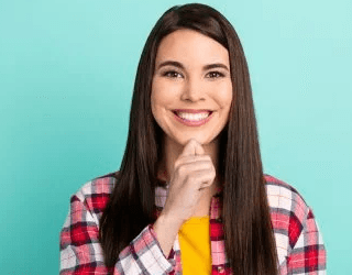 woman smiling holding chin