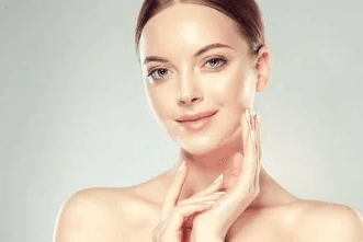 woman touching face smiling